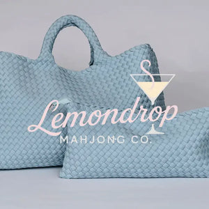 Light blue woven leather tote and pouch set, stylish and versatile for daily use.