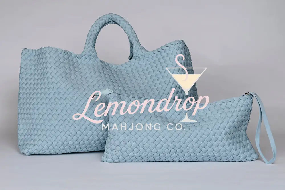 Light blue woven leather tote and pouch set, stylish and versatile for daily use.