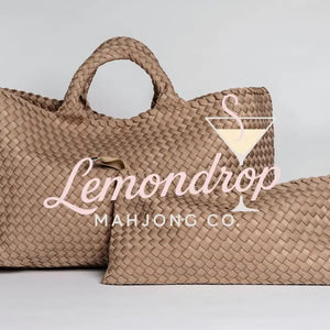Large and small woven bags in light tan, made of durable material, perfect for stylish storage.