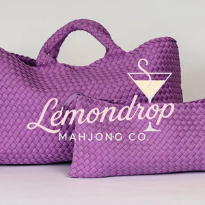 Large and small woven purple bags made of durable material, ideal for stylish storage and travel.